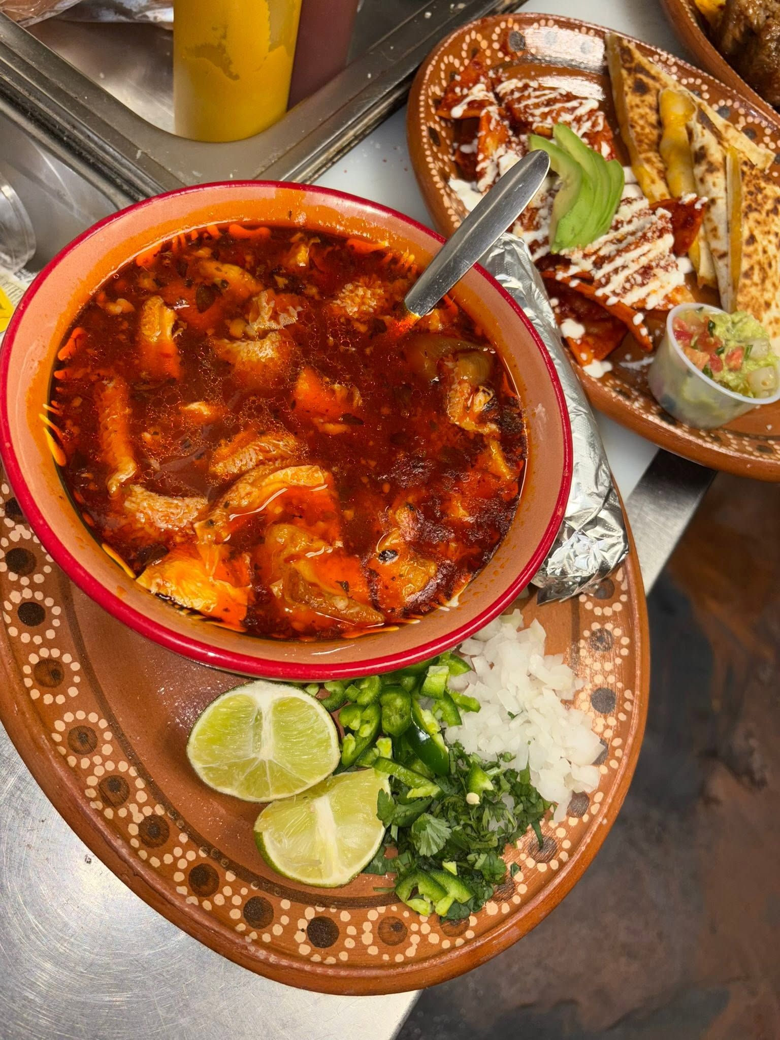 Caldo de camarón shrimp soup with lime, jalapeño, onion, and cilantro