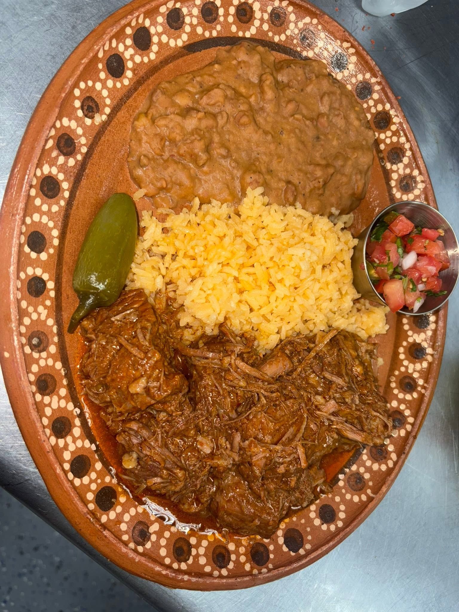 Carne asada plate with charro beans, Mexican rice, and pico de gallo